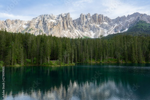 Beautiful view of Lago di Carezza with mountain reflections in the water. Trentino-Alto Adige, Italy
