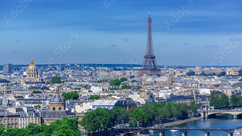 Paris, typical roofs, aerial view with the Eiffel Tower, the Invalides dome and the Sainte-Chapelle in background, view from the Saint-Jacques tower  photo