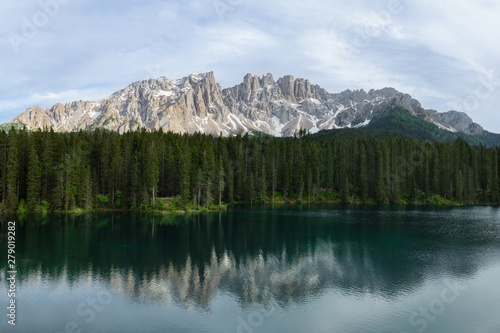 Panoramic view of Carezza Lake with reflecting in the water mount Latemar. South Tyrol, Italy
