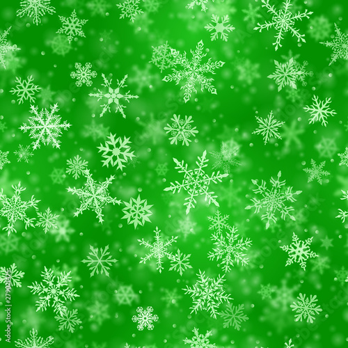 Christmas seamless pattern of complex blurred and clear falling snowflakes in green colors with bokeh effect