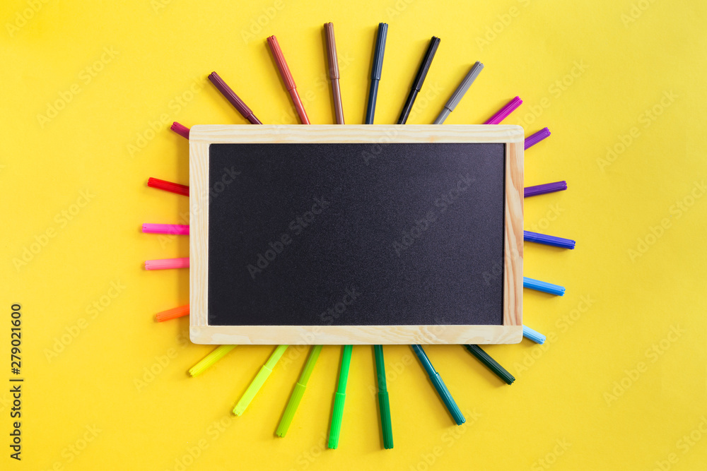 School Supplies And Coloring Pens Flat Lay On Yellow Background