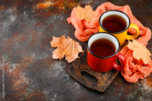 Enameled cup of hot tea photo