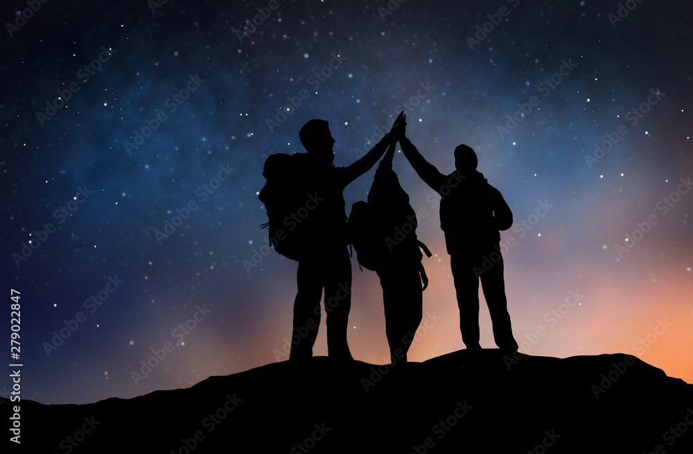 Φωτογραφία travel, hike and success concept - group of travelers or friends making high fiv