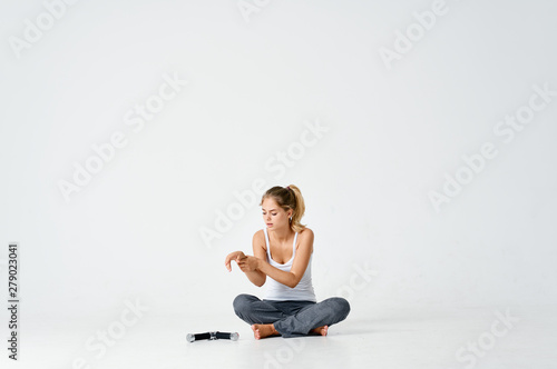 young woman sitting on the floor
