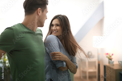 Happy young couple flirting...