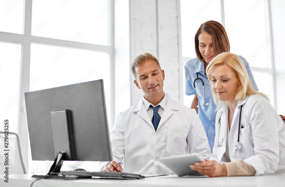 healthcare, medicine and technology concept - group of doctors with tablet computer at hospital healthcare, medicine and technology concept - group of doctors with tablet computer at hospital