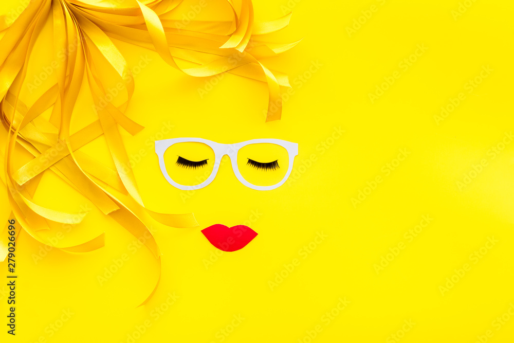 Make up concept with face model for visagiste work on yellow background top view mockup