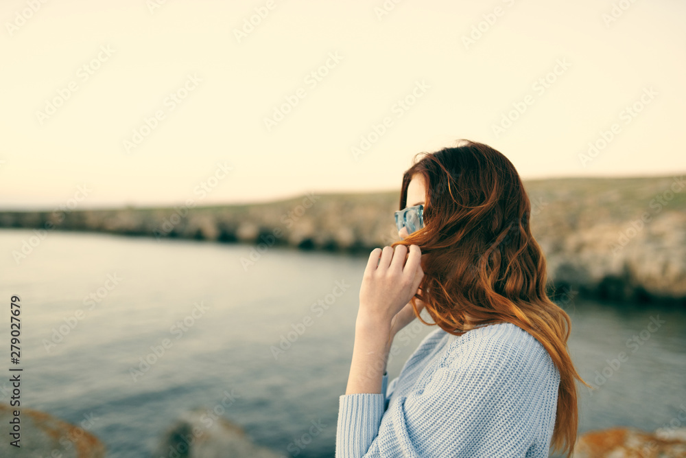 young woman looking at the sea
