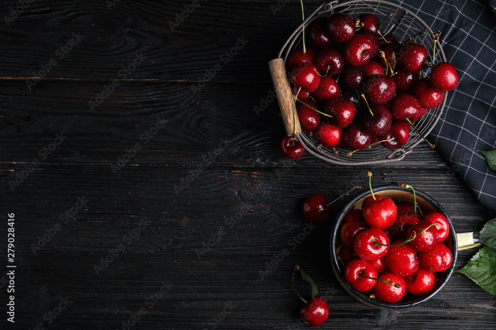 Flat lay composition with sweet cherries on dark wooden table. Space for text Flat lay composition with sweet cherries on dark wooden table. Space for text