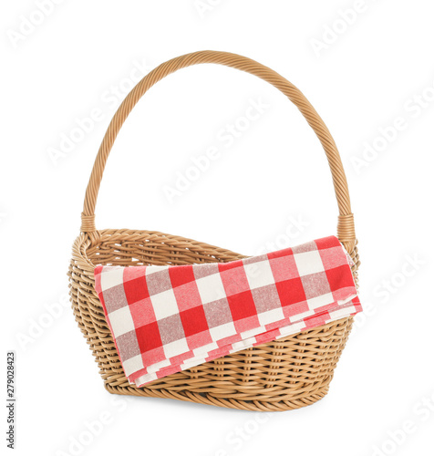 Wicker picnic basket with checkered blanket on white background