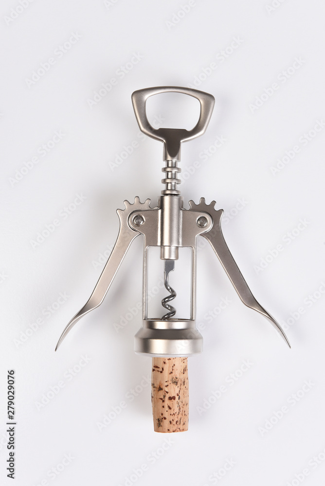 A wing style corkscrew and cork on white A wing style corkscrew and cork on white