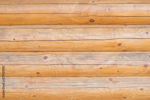The texture of the wood. A wood background made of wood. A wooden fence.