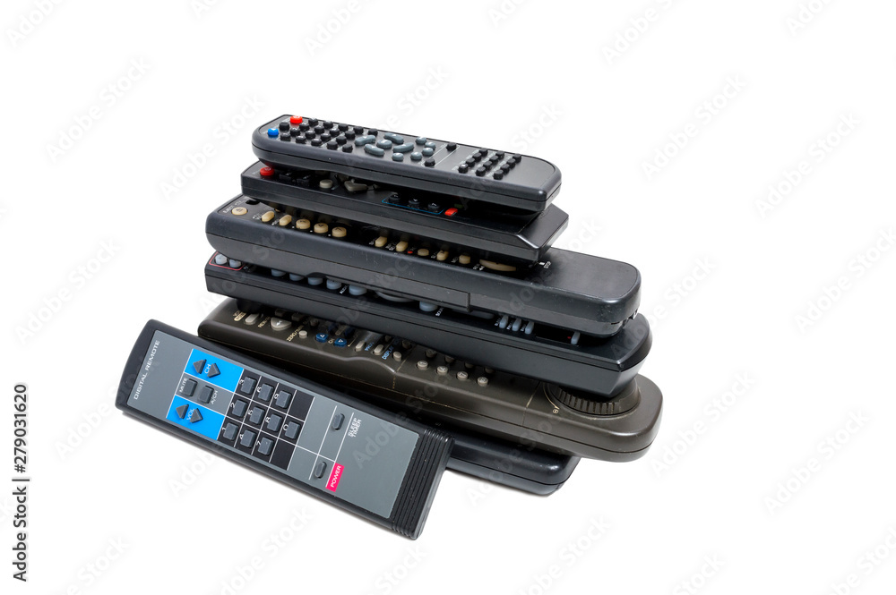 Stack of Many Remote Controls On White Stack of Many Remote Controls On White