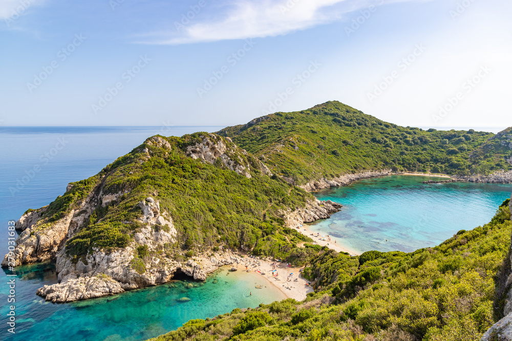 Famous two side Porto Timoni beach near Agios Georgios. Crystal clear azure water. Corfu, Greece