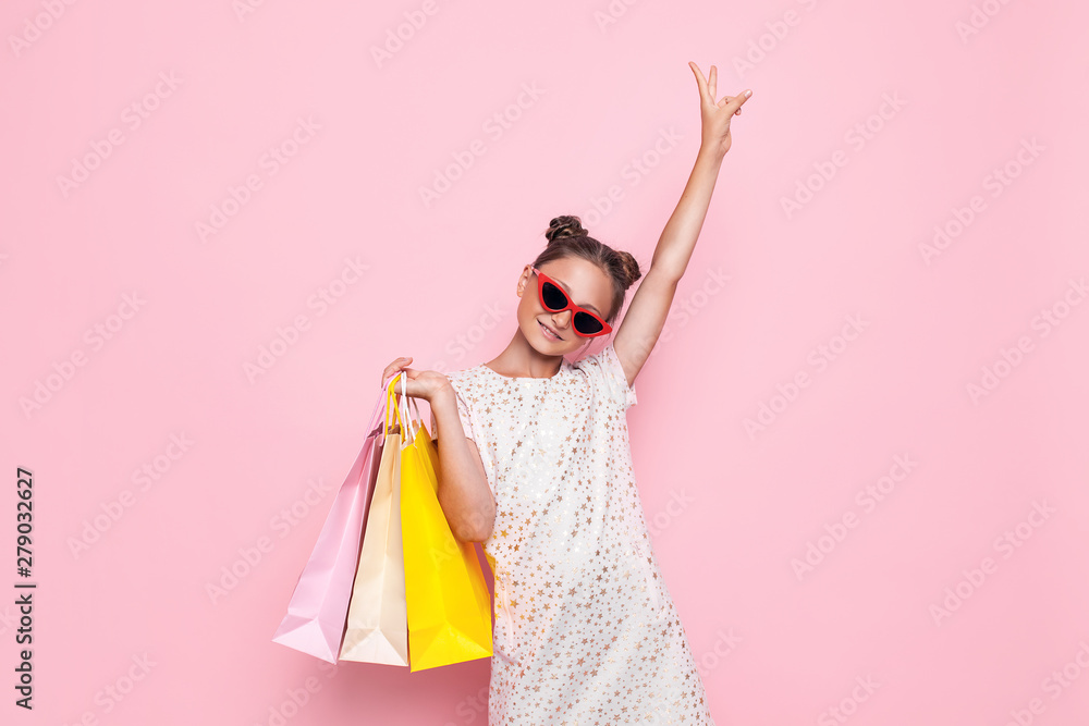 girl in stylish dress, teenager with purchases in hands, after shopping trip girl in stylish dress, teenager with purchases in hands, after shopping trip