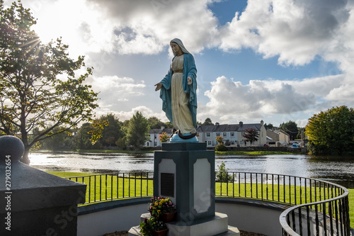 A statue of Mary beside the river in the town of Ballina, Ireland