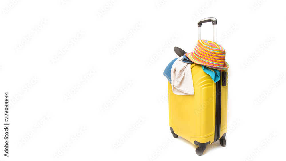 yellow suitcase with clothes of ttourist on a white background. concept quick fees late on the plane yellow suitcase with clothes of ttourist on a white background. concept quick fees late on the plane