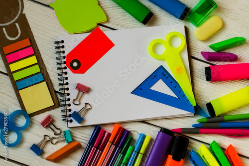 School and office supplies on a wooden table