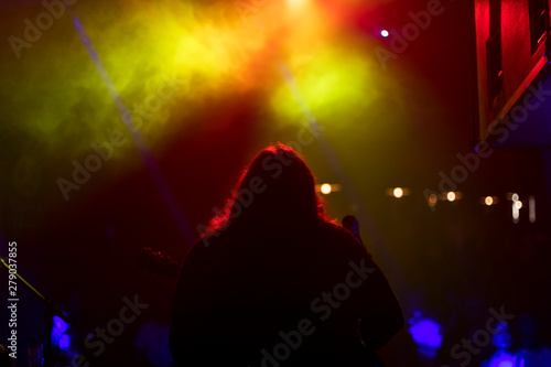 silhouette of a man on stage