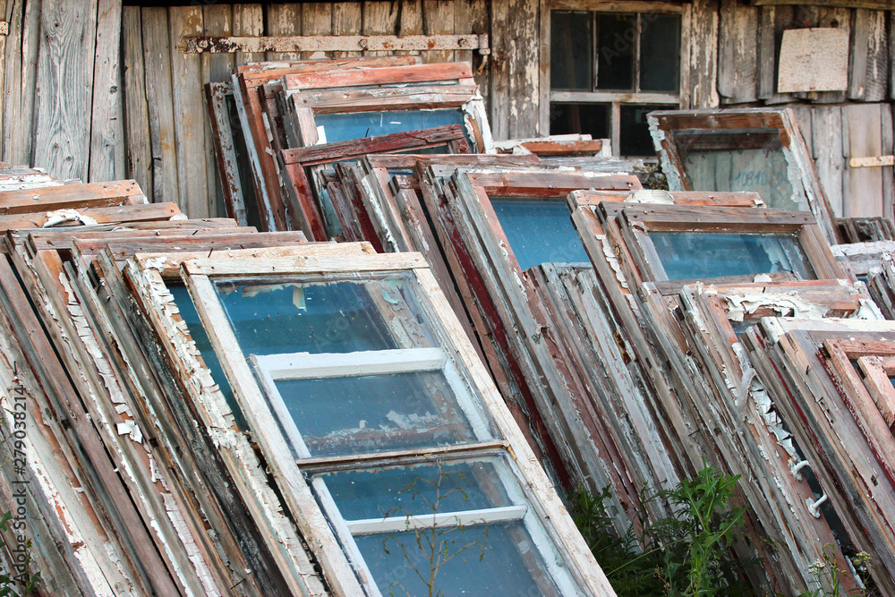 Piles of old wooden frames and windows