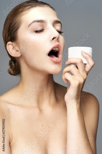 young smiling woman with perfect skin on face looking at camera