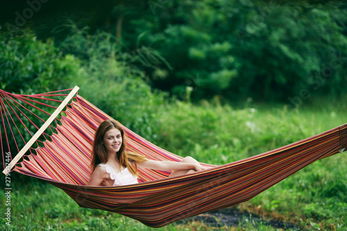 young woman relaxing in hammock