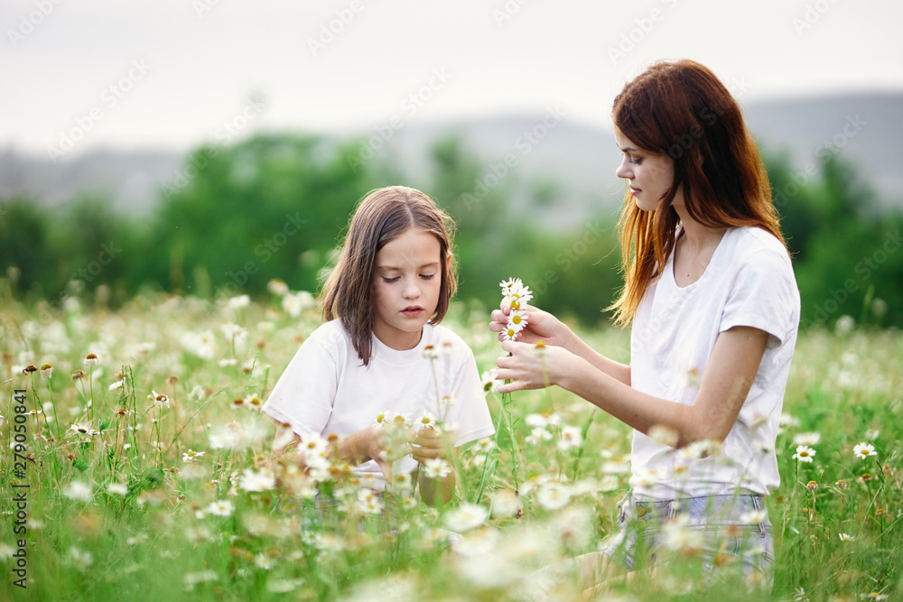 mother and daughter in the field mother and daughter in the field