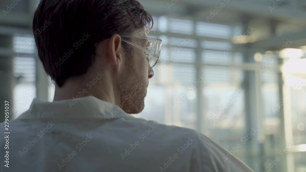 Close Up in slow motion of a medic or scientist looking at the horizon Close Up in slow motion of a medic or scientist looking at the horizon