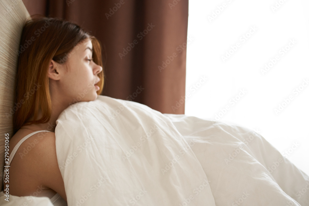 young woman in bed