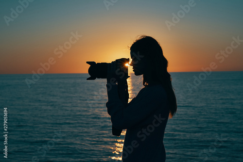 silhouette of photographer at sunset