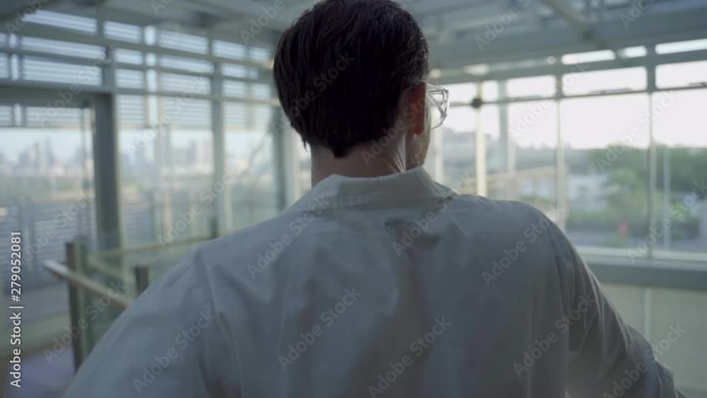 Slow push in - a science researcher or technician standing in a hospital or lab Slow push in - a science researcher or technician standing in a hospital or lab