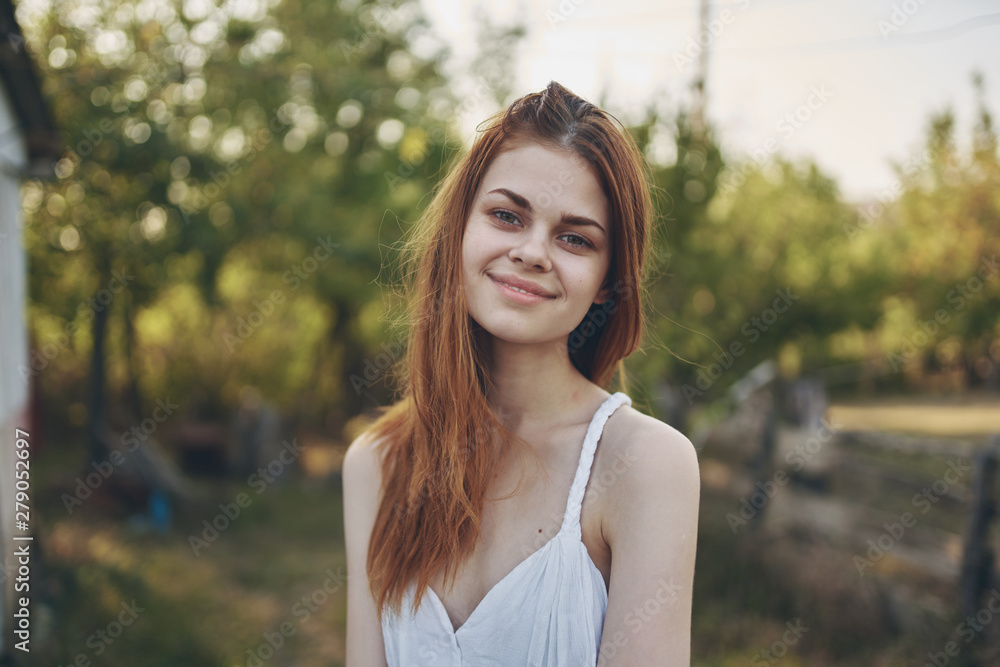portrait of young woman in the park portrait of young woman in the park