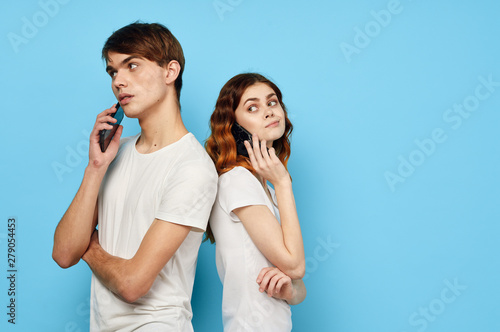 two girls talking on cell phone