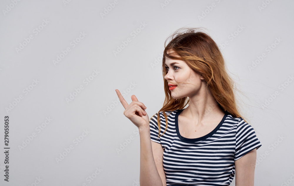 portrait of young woman pointing at copyspace portrait of young woman pointing at copyspace