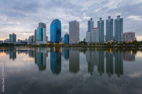 City building with water reflection before sunset