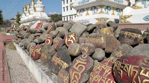 This prayer stones are in front of Peme Awam Choegar Gyurme Ling Monastery which situated in Tibetan colony in Bir Billing town in Indian Himachal Pradesh. photo