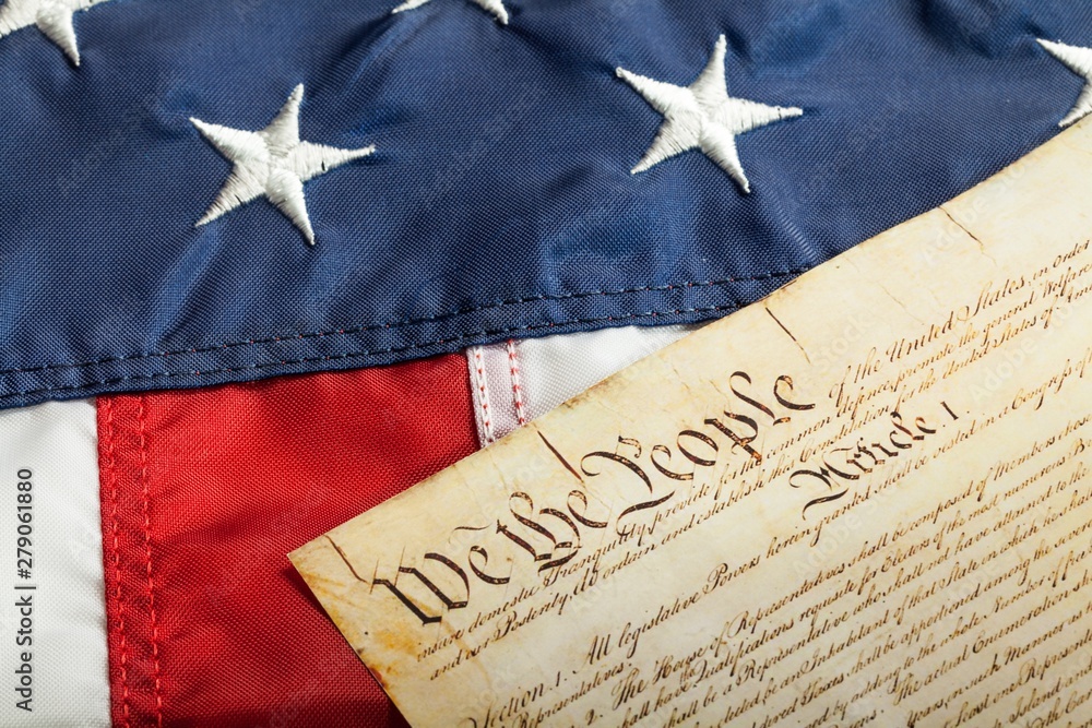 Fototapeta premium The American Constitution on American Flag