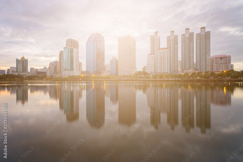 City building with water reflection before sunset