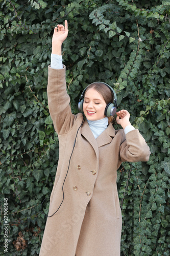 Beautiful young woman liste...