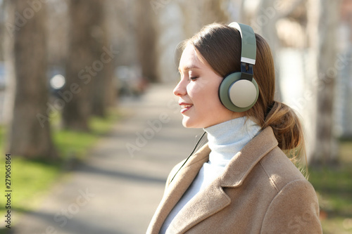 Beautiful young woman liste...