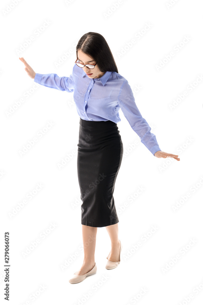 Balancing young businesswoman on white background Balancing young businesswoman on white background