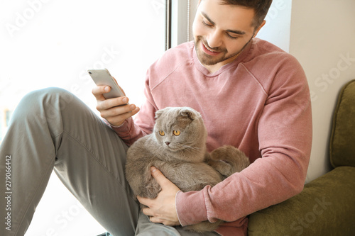 Young man with cute funny c...
