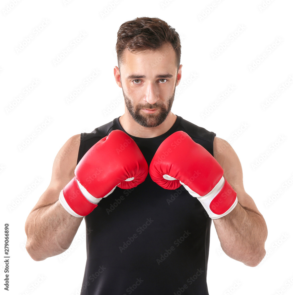 Strong male boxer on white background