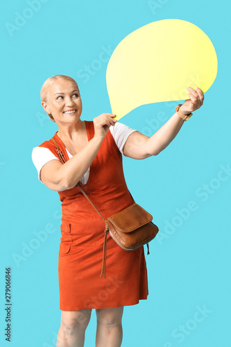 Stylish mature woman with speech bubble on color background