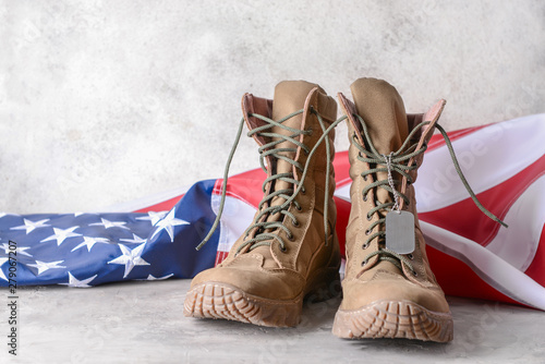 Military boots and USA flag on table Fototapet