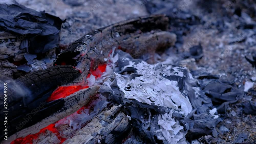 Close up, Letters, sheets of paper burning in the fire in the forest. The smoldering ash and scatters in the wind. 4k uhd Close up, Letters, sheets of paper burning in the fire in the forest. The smoldering ash and scatters in the wind. 4k uhd