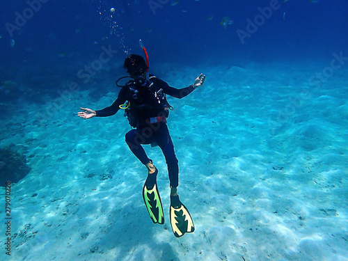 Bild auf Leinwand A diver enjoying a leisure dive in Tunku Abdul Rahman Park, Kota Kinabalu