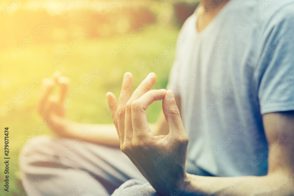 Fototapeta premium Meditation man's hands yoga gestur in nature. Yoga fingers