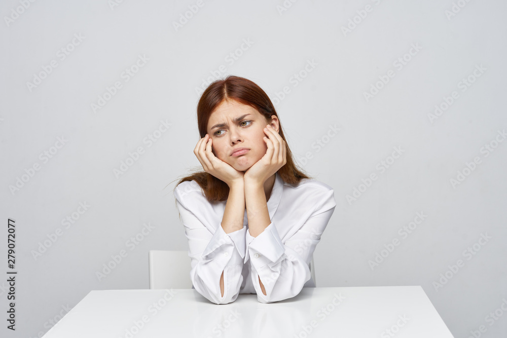 portrait of a young woman sitting on sofa portrait of a young woman sitting on sofa