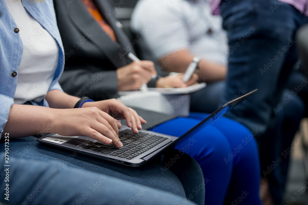 business people hands typing on laptop computer keyboard during the seminar at conference room business people hands typing on laptop computer keyboard during the seminar at conference room